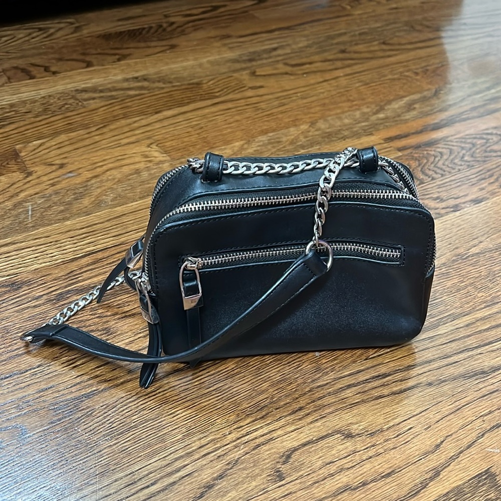 Faux leather discontinued Akaiv cross body purse. Tape measure for size.
